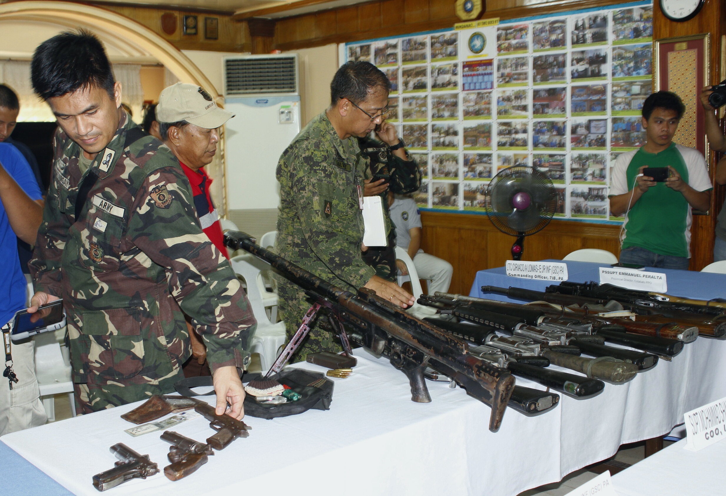 JOINT OPERATION. Authorities present firearms recovered during a joint anti-drug operation by the government and the MILF. All photos from the Office of the Presidential Adviser on the Peace Process  