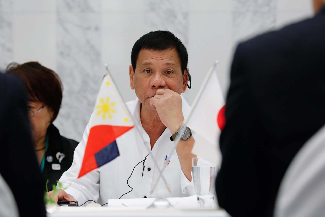 DIPLOMAT-IN-CHIEF. President Rodrigo Duterte listens to the English translation of the discussion with Keidanren officials over lunch at the Prince Tower Tokyo Hotel in Japan on October 26. ALBERT ALCAIN/Presidential Photo 