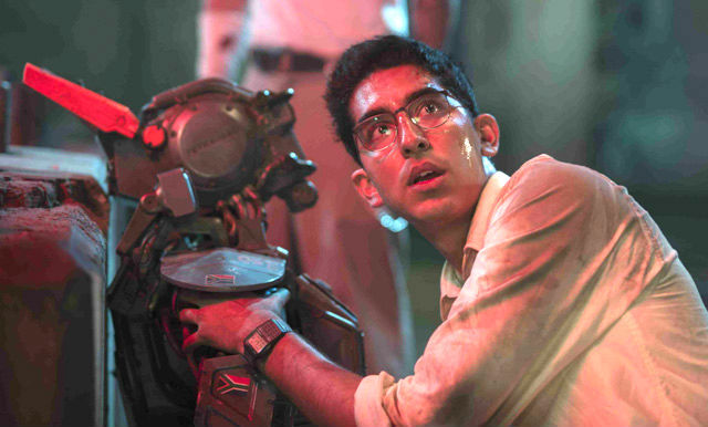 DEON AND CHAPPIE. The two form a bond in the latest film from Neill Blomkamp. Photos courtesy of Columbia Pictures