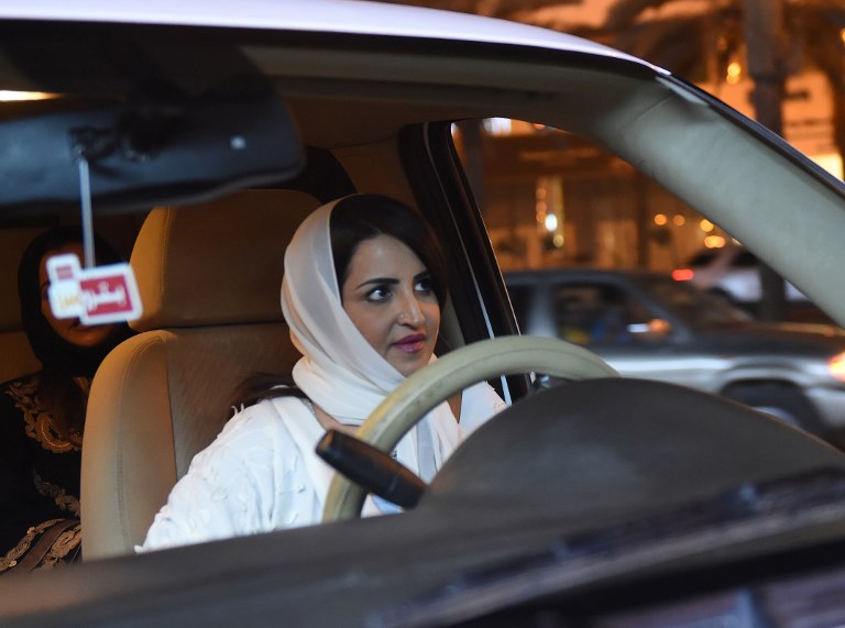 BAN LIFTED. Saudi Samar Al-Moqren drives her car through the streets of the Saudi capital Riyadh for the first time just after midnight, June 24, 2018, when the law allowing women to drive took effect. Photo by Fayez Nureldine/AFP 