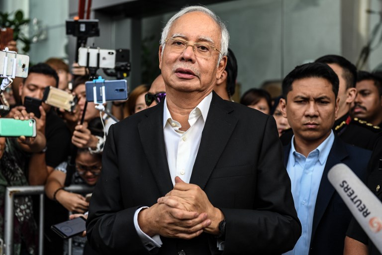'BIGGEST SEIZURE.' Malaysia's former prime minister Najib Razak speaks to the media after being questioned at the Malaysian Anti-Corruption Commission office in Putrajaya on May 24, 2018. File photo by Mohd Rasfan/AFP  