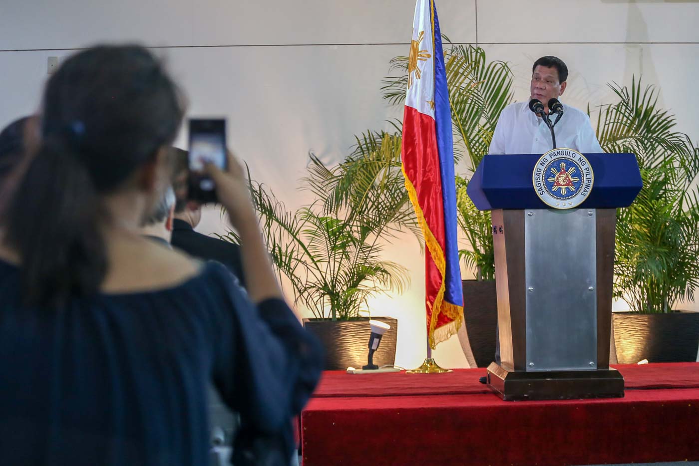 DEPARTURE SPEECH. President Rodrigo Duterte delivers a message at the Davao International Airport on November 17, 2016, before leaving for Lima, Peru to attend APEC Leaders' Meeting. Photo by Manman Dejeto/Rappler   