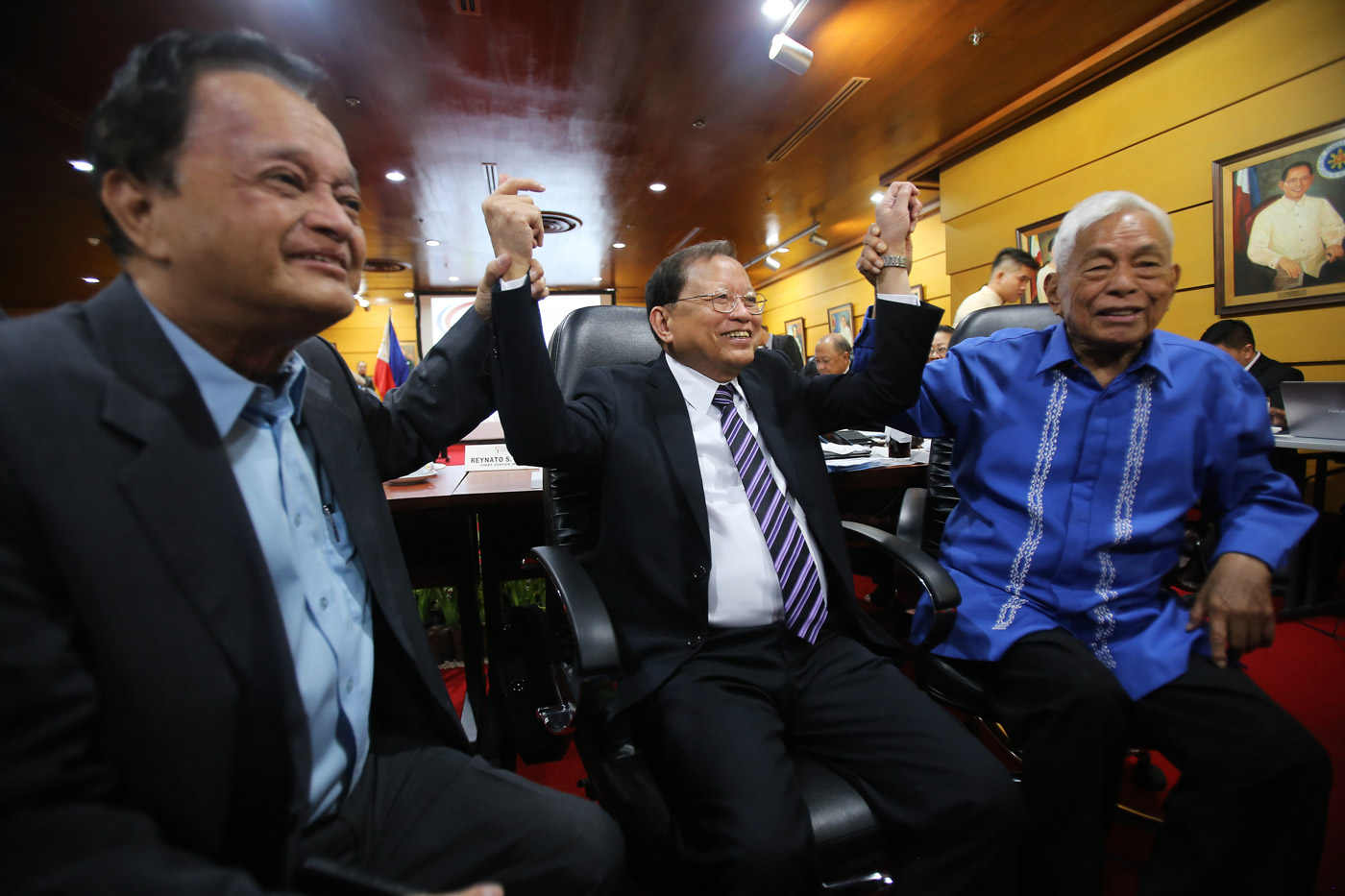 CULMINATION OF EFFORTS. Con-Com chairman Reynato Puno, flanked by members Antonio Nachura and Aquilino Pimentel Jr, celebrate after voting to approve a draft federal constitution. Photo by Ben Nabong/Rappler 