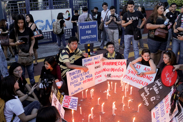 CANDLE-LIGHTING. Candles are lit and prayers offered to raise awareness on widespread contractualization in the country. Photo by Faye Sales  