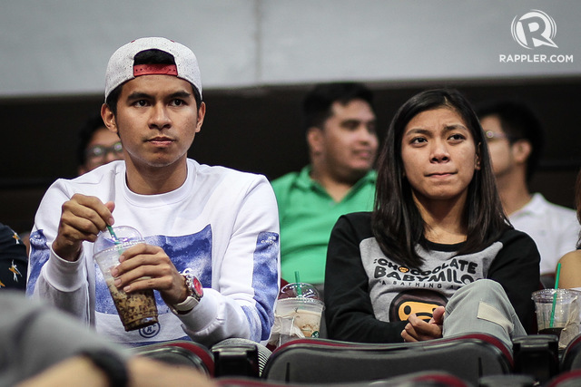 FROM THE STANDS. Kiefer Ravena (L) and Alyssa Valdez (R) watch on as Ateneo takes on UP. Josh Albelda/RAPPLER
