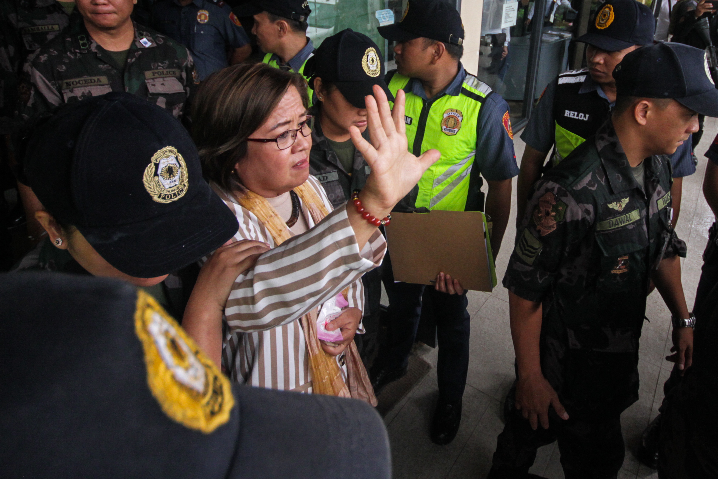 OPPOSITION SENATOR. Detained Senator Leila De Lima is whisked away after attending a hearing at Muntinlupa Regional Trial Court on August 9 2019. Photo by Lito Borras/Rappler 