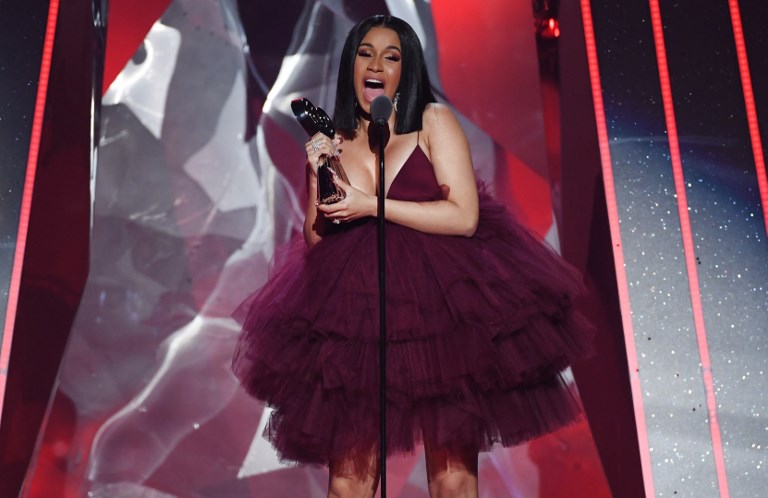 PREGNANT. Photo shows rapper Cardi B accepting the Best New Artist onstage during the 2018 iHeartRadio Music Awards  on March 11. The rapper confirmed her pregnancy on 'Saturday Night Live.' File photo by Kevin Winter/Getty Images for iHeartMedia/AFP  