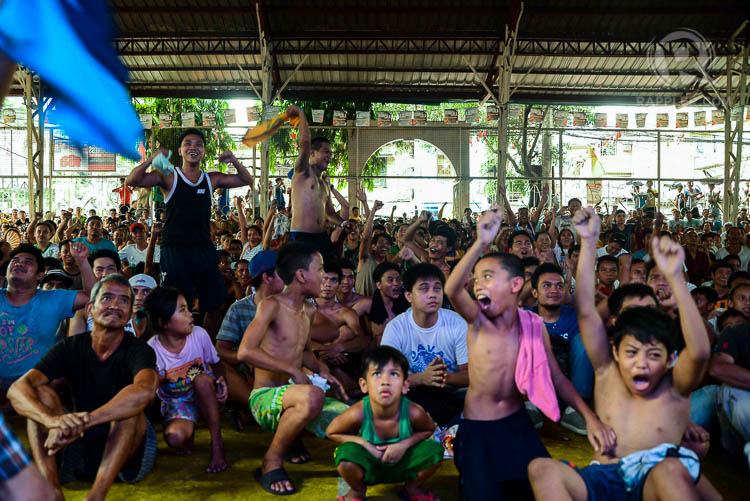 MANILA DURING FIGHT NIGHT. Filipino boxing fans take off their clotheswhile watching the #MayPac fight inside the packed and humid Sarmiento Sports Complex in Sta. Mesa, Manila. Photo by Jansen Romero/Rappler 