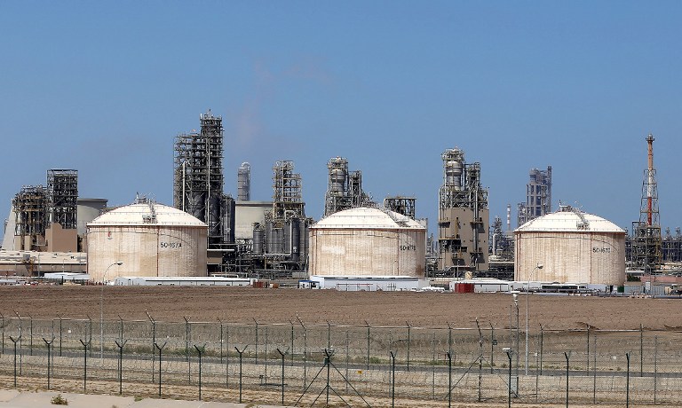 PRODUCTION CUT. A general view taken on April 16, 2016 shows the Shuaiba oil refinery south of Kuwait City. File photo by Yasser al-Zayyat/AFP 