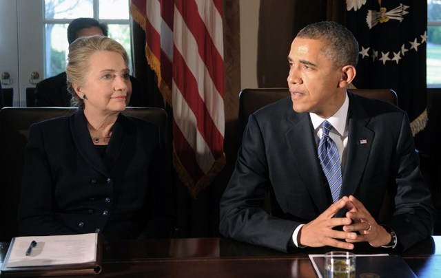 POWER COUPLE. In this file photo, US President Barack Obama (R) speaks as then-Secretary of State Hillary Clinton listens during a cabinet meeting at the White House in Washington, DC, on November 28, 2012. Jewel Samad/File/AFP
