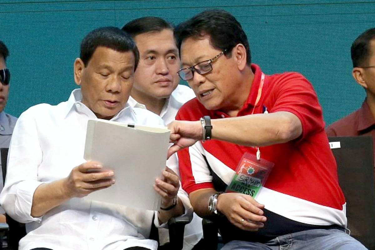 'LAST CARD.' President Rodrigo Duterte and Labor Secretary Bebot Bello attend a Labor Day event. Malacañang file photo   