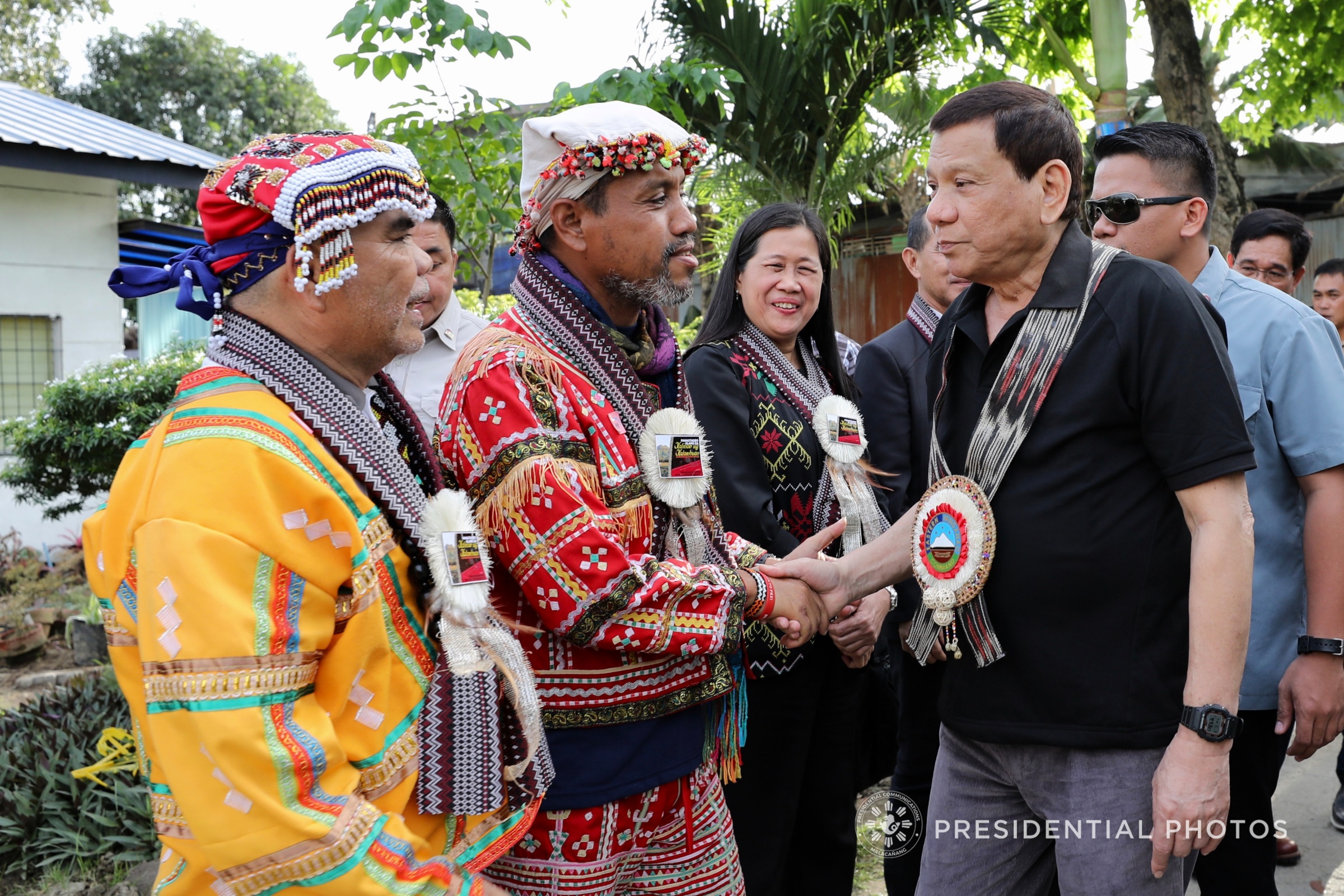 LUMAD LEADERS. President Rodrigo Duterte greets Supreme Tribal Council for Peace and Development Chair Datu Roel Ali and Mindanao IP Council for Peace and Development Chair Datu Joel Unad at the Indigenous Peoples Leaders' Summit in Davao City. Malacañang file photo 