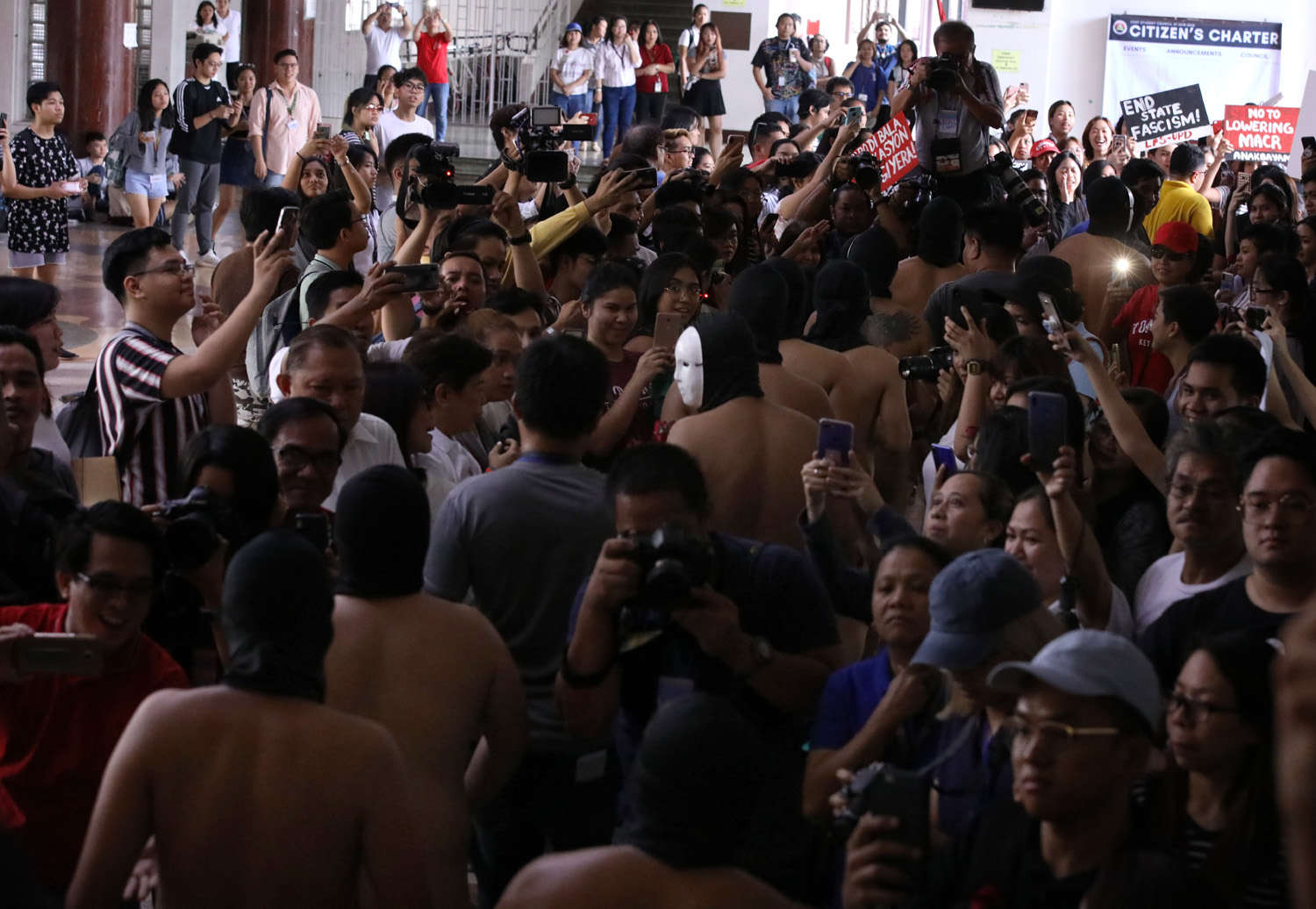 NAKED. Members of the Alpha Phi Omega fraternity walk naked during their annual Oblation Run at the University of the Philippines Diliman on Friday, February 8, 2019. Photo by Darren Langit/Rappler 