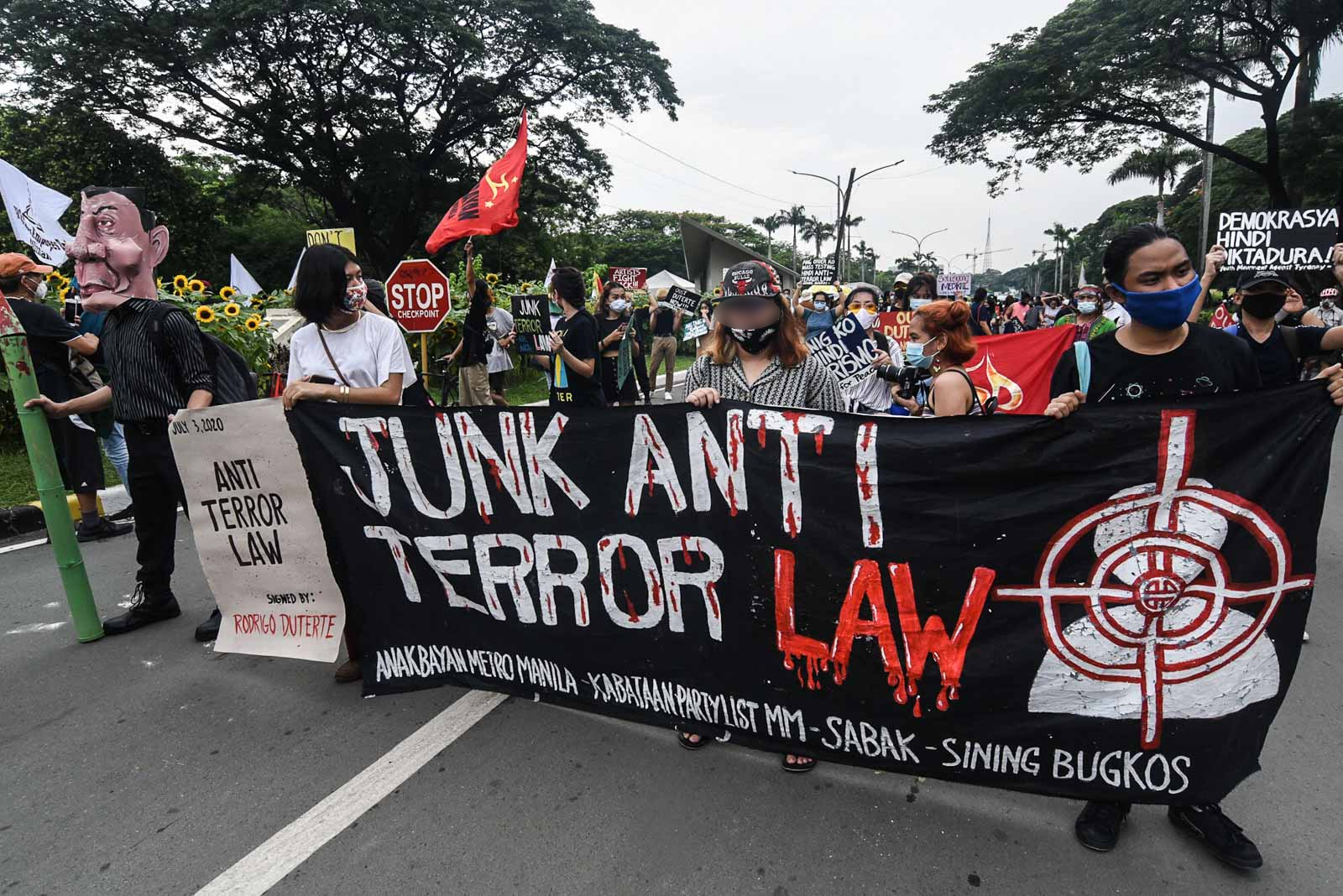 JUNK. Protesters from different groups stage a protest march against the new anti-terror law at the University of the Philippines in Diliman, QC on July 4, 2020. Photo by Angie de Silva/Rappler 