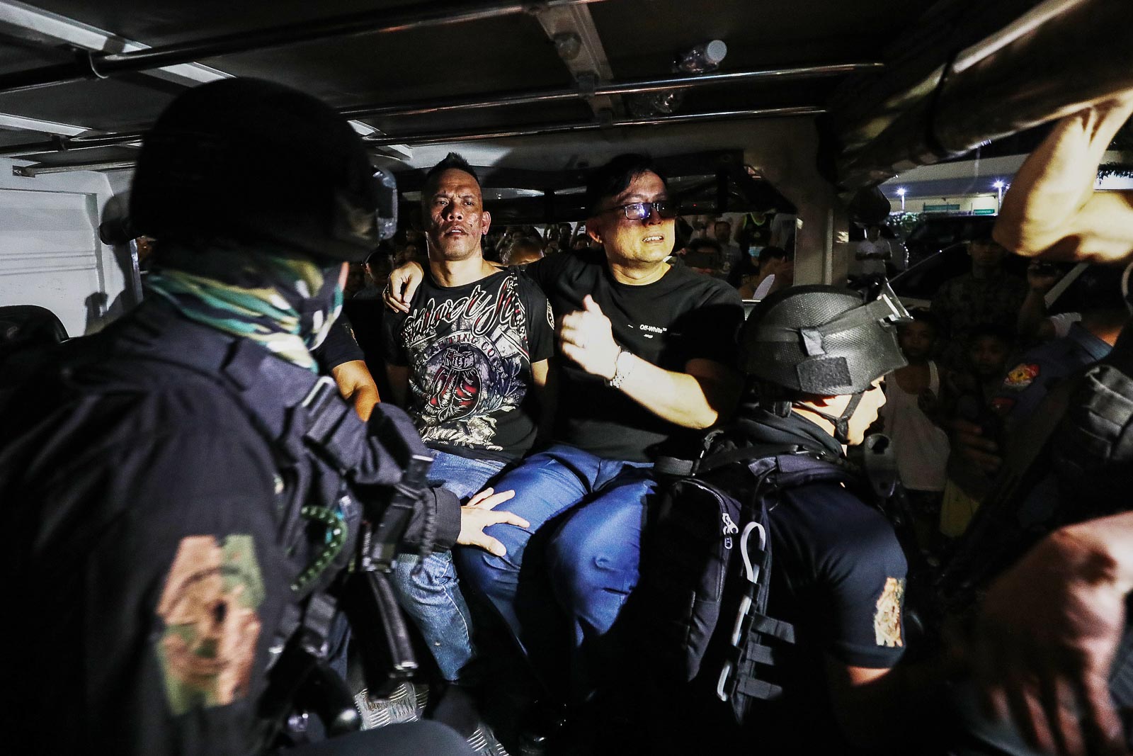 ARRESTED. SWAT personnel escort hostage taker Alchie Paray outside of the Greenhills Shopping Center on March 2, 2020. Photo by Ben Nabong/Rappler 