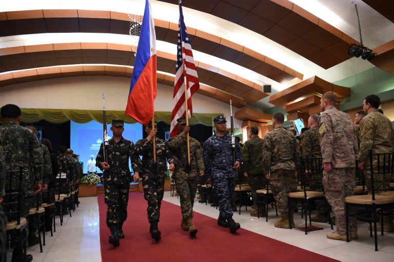 TREATY ALLIES. The Philippine and US flags during the opening ceremony of the yearly Balikatan joint military exercises in April 2016. File photo by Ted Aljibe/AFP 