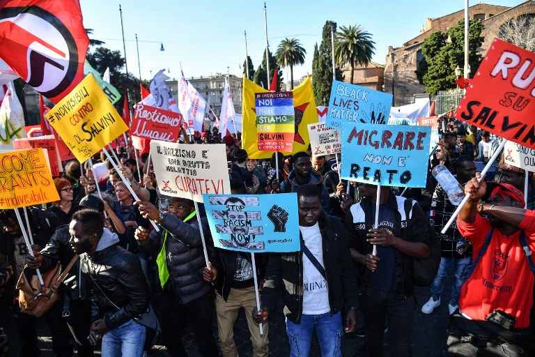 POLICY PROTEST. People, including employees of the country's social and reception centers and members of anti-racism associations, march during a demonstration against the government's social politics, its recent decree restricting the right to asylum, and against racism on November 10, 2018 in downtown Rome. Photo by Alberto Pizzoli/AFP 