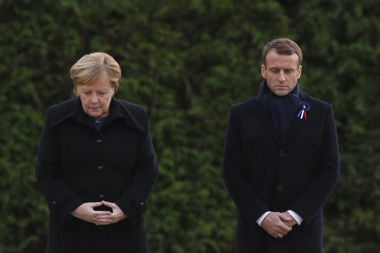 REMEMBERING. French President Emmanuel Macron and German Chancellor Angela Merkel stand side-by-side during a French-German ceremony in the clearing of Rethondes (the Glade of the Armistice) in Compiegne, northern France, on November 10, 2018 as part of commemorations marking the 100th anniversary of the 11 November 1918 armistice, ending World War I. Photo by Philippe Wojazer/AFP 