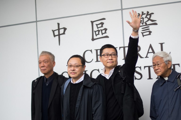 'OCCUPY CENTRAL' FOUNDERS. In this file picture taken on December 3, 2014, (from L to R) founders of the "Occupy Central" movement Chu Yiu-ming, Benny Tai, Chan Kin-man and Chinese Cardinal of the Catholic Church and former bishop of Hong Kong Joseph Zen leave a police station in Hong Kong after Chu, Tai and Chan handed themselves in. File photo by Johannes Eisele/AFP 