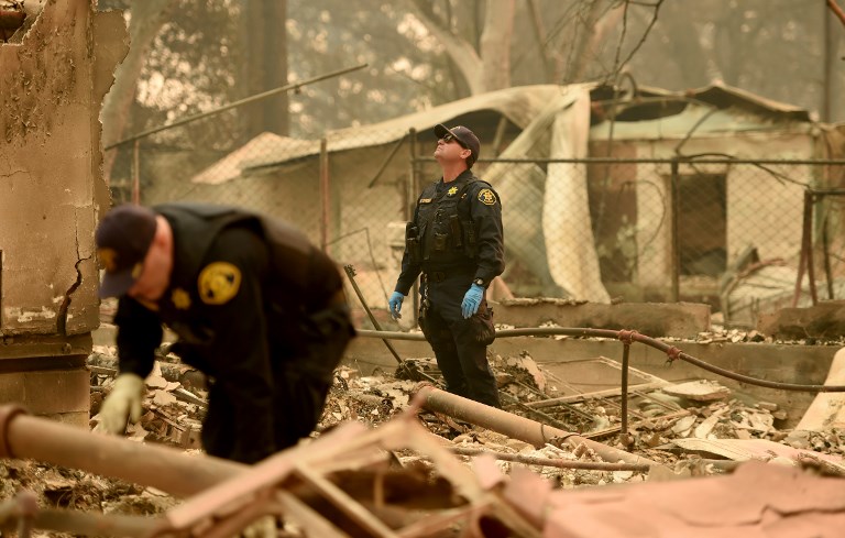 DEADLY BLAZE. Alameda County Sheriff Coroner officers search for remains at a burned residence in Paradise, California, on November 12, 2018. Photo by Josh Edelson/AFP 
