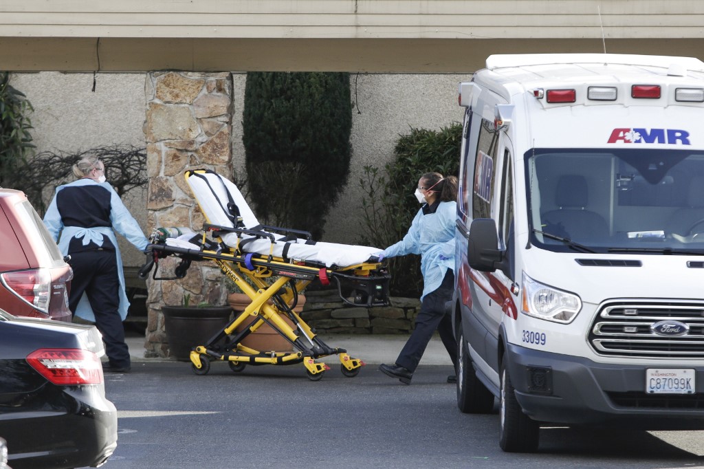 STRETCHER. A stretcher is moved from an AMR ambulance to the Life Care Center of Kirkland where one associate and one resident were diagnosed with the novel coronavirus (COVID-19). Photo by Jason Redmond/AFP 