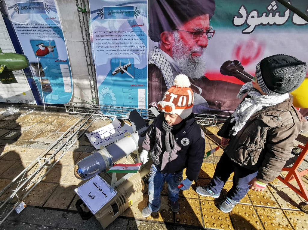 KIDS. Iranian children pose with replica military equipment during commemorations marking 41 years since the Islamic Revolution, in the capital Tehran on February 11, 2020. Photo by Atta Kenare/AFP 