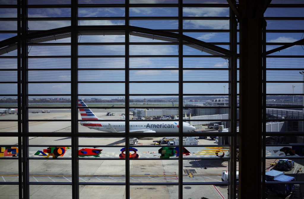 BADLY HIT SECTOR. An American Airlines plane is seen from a terminal of Reagan National Airport in Arlington, Virginia, on March 17, 2020. Photo by Mandel Ngan/AFP 