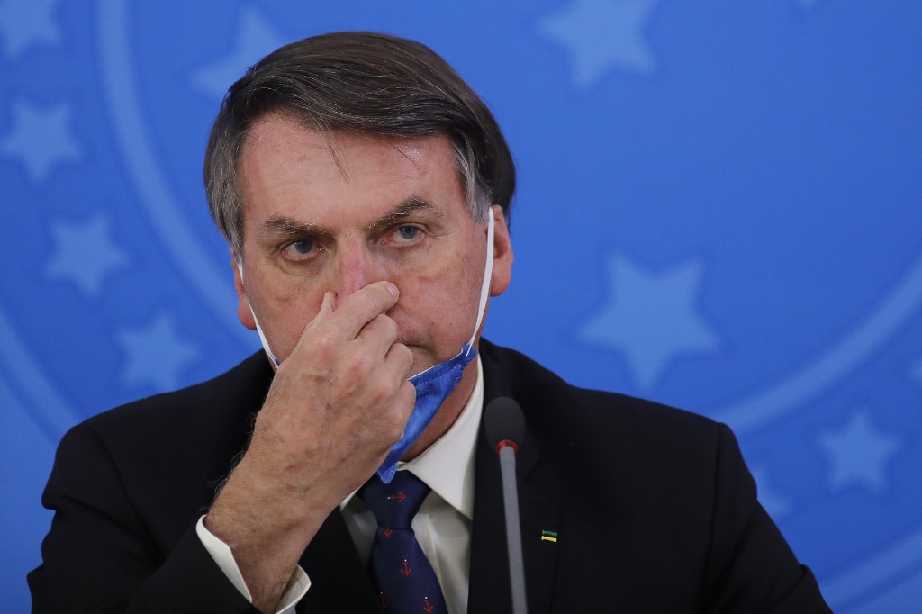 BOLSONARO. Brazil's President Jair Bolsonaro gestures during a press conference on the coronavirus pandemic COVID-19 at the Planalto Palace in Brasilia, Brazil on March 20, 2020. Photo by Sergio Lima/AFP 