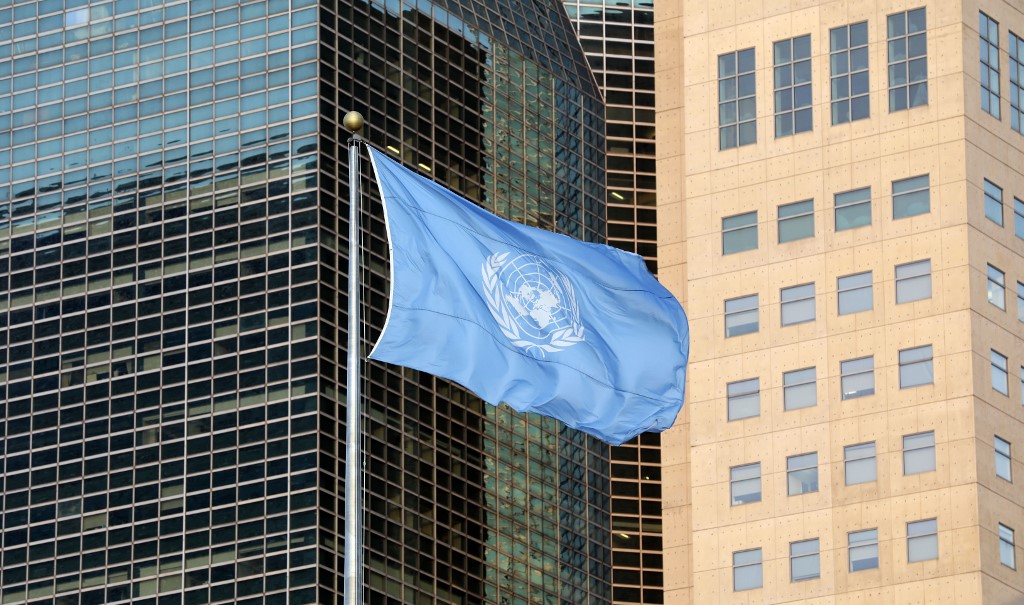 UNITED NATIONS. In this file photo The United Nations flag is seen is seen during the Climate Action Summit 2019 at the United Nations General Assembly Hall September 23, 2019 in New York City. Photo by Ludovic Marin/AFP 