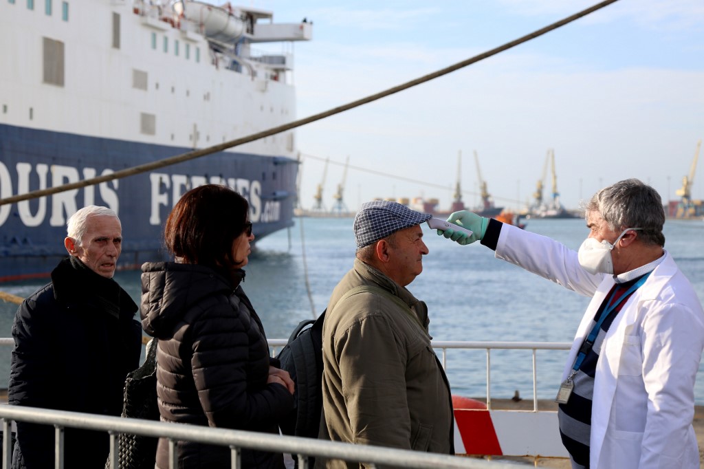 INCOMING. Medical staff check incoming passengers coming from Italy to detect any possible symptoms of COVID-19 at Albaniaâs main port city of Durres on February 26, 2020. Photo by Gent Shkullaku/AFP 