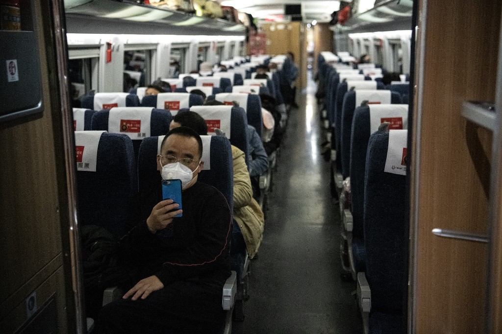 LOW TRANSPORT DEMAND. A passenger uses his mobile phone as a train stops at Wuhan railway station in China's central Hubei province on March 4, 2020. Photo by Noel Celis/AFP 