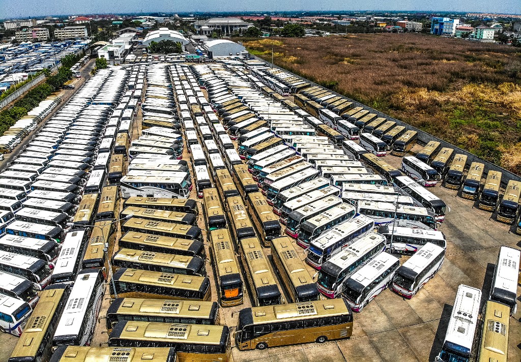 THAI TOURISM HIT. An aerial photo shows unused tourist buses parked on a lot near Suvarnabhumi Airport in Bangkok on March 8, 2020. Photo by Mladen Antonov/AFP 