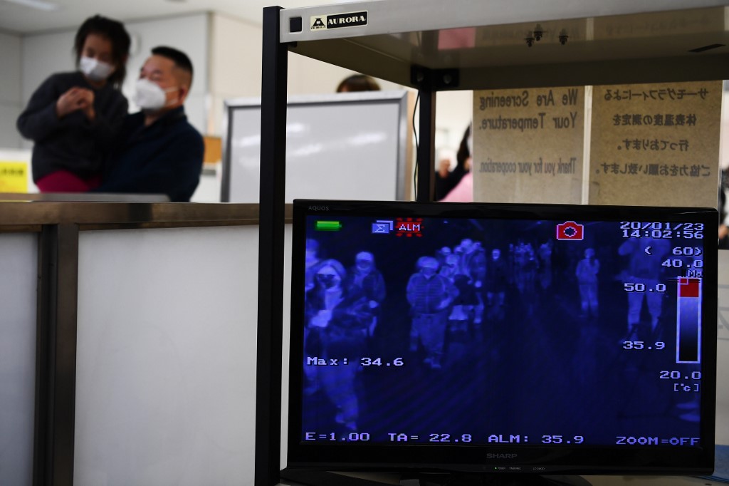 QUARANTINE. In this file photo, passengers who arrived on one of the last flights from the Chinese city of Wuhan walk through a health screening station at Narita airport in Chiba prefecture, outside Tokyo, on January 23, 2020. File photo by Charly Triballeau/AFP 