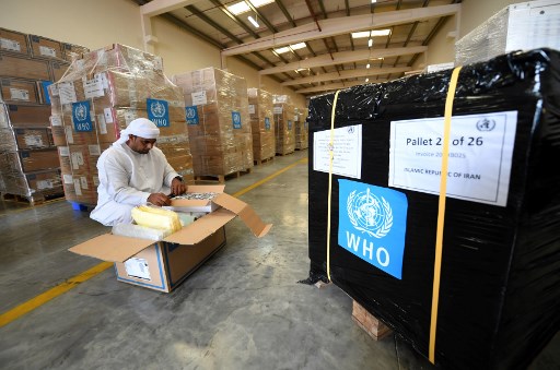 AID. Officials check medical equipment and coronavirus testing kits provided at the World Health Organization at the al-Maktum International airport in Dubai on March 2, 2020 as tonnes of aid is prepared to be delivered to Iran with a United Arab Emirates military transport plane. Photo by Karim Sahib/AFP 
