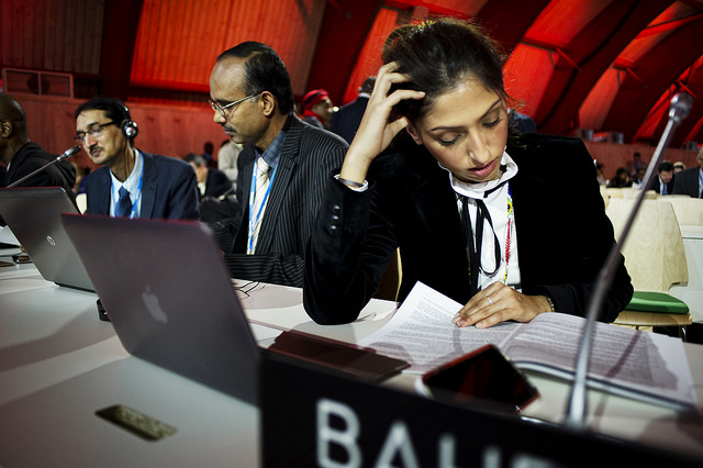 CRUNCH TIME. Negotiators read through the draft text of the Paris agreement during the Comité de Paris meeting at the COP21 climate change conference in Le Bourget, France, December 9, 2015. Photo by Benjamin Géminel/COP21 