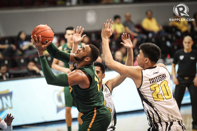 GETTING THAT W. Prince Orizu (L) and FEU prevail over UST. Photo by Josh Abelda/Rappler