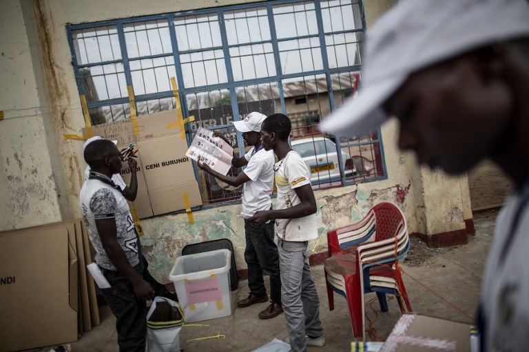 In this file photo, electoral officials gather in the courtyard of the administrative building of the Bwiza district of Bujumbura, where ballots are counted on June 29, 2015. Marco Longari/AFP
