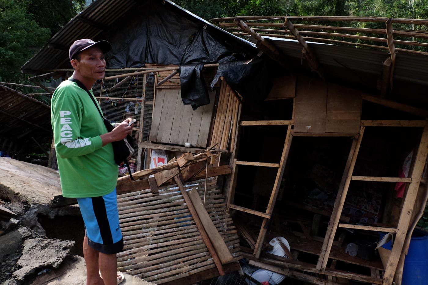 HOMES LOST. A man stands over a damaged home in Barangay Ilomavis, Cotabato. Photo by Bobby Lagsa/Rappler 