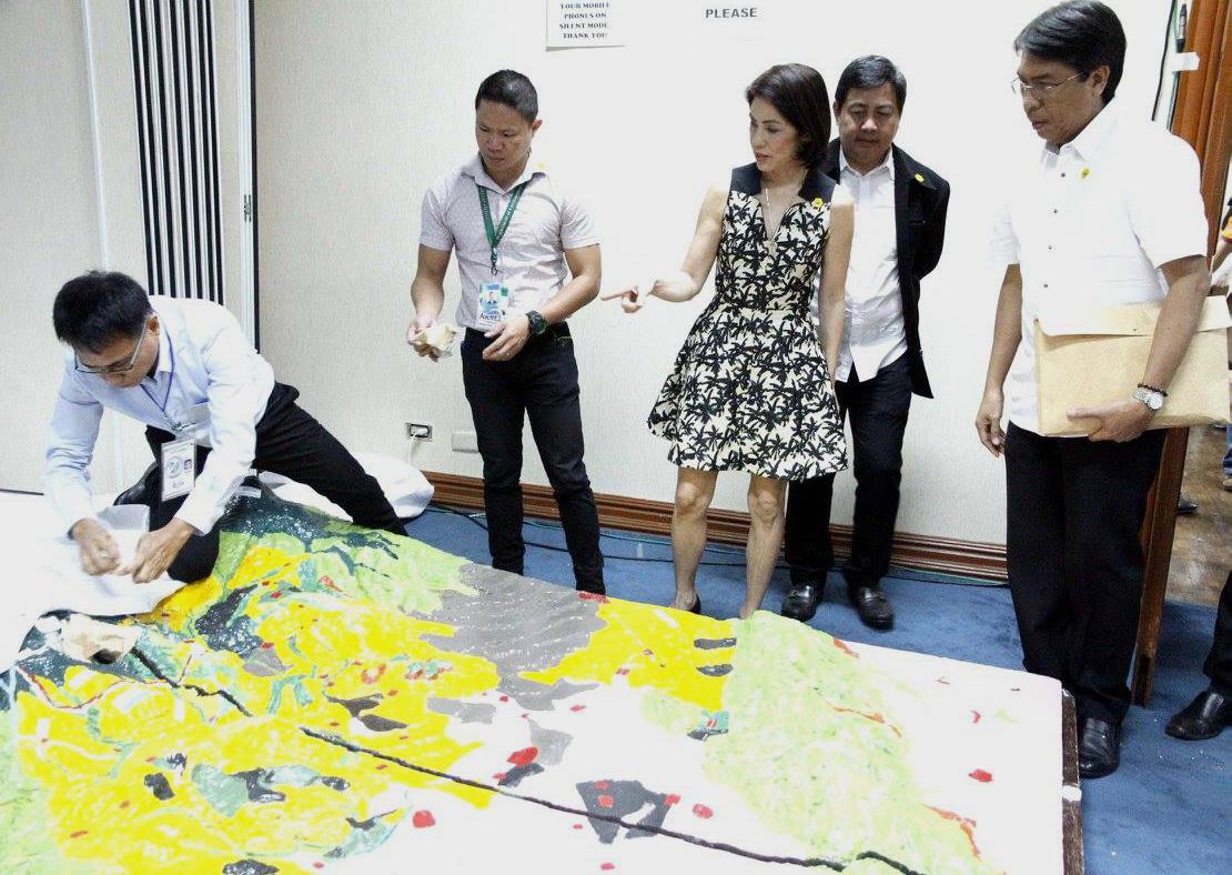 TAMPAKAN. In this file photo, Environment Secretary Gina Lopez looks at a miniature sculpture of Tampakan during her confirmation hearing before the Commission on Appointments. File photo from Senate of the Philippines Facebook page 