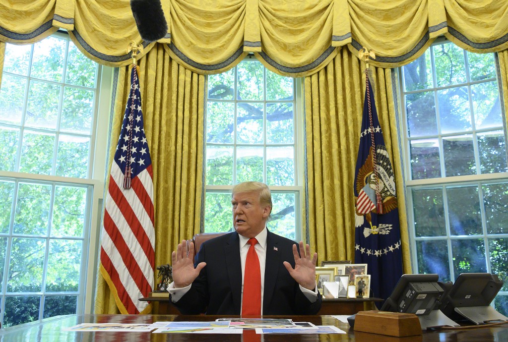 TRUMP AT THE WHITE HOUSE. In this file photo taken on September 4, 2019 US President Donald Trump updates the media on Hurricane Dorian preparedness from the Oval Office at the White House in Washington, DC. File photo by Jim Watson/AFP 