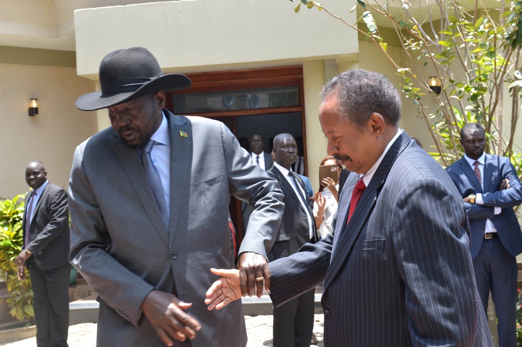 FIRST OFFICIAL VISIT. Sudan's prime minister Abdalla Hamdok (L) and South Sudan's President Salva Kiir Mayardit shake hands before meeting on September 12, 2019 in the capital city of Juba, South Sudan. Photo by Akuot Chol/AFP 