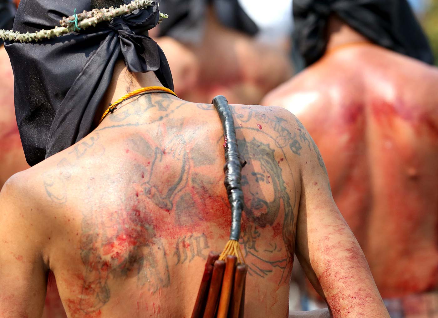 SPECIAL INTENTION. A tattooed image of Christ is speckled with a penitent's blood in La Loma, Quezn City, on Maundy Thursday, April 19, 2019. Photo by Inoue Jaena/Rappler 