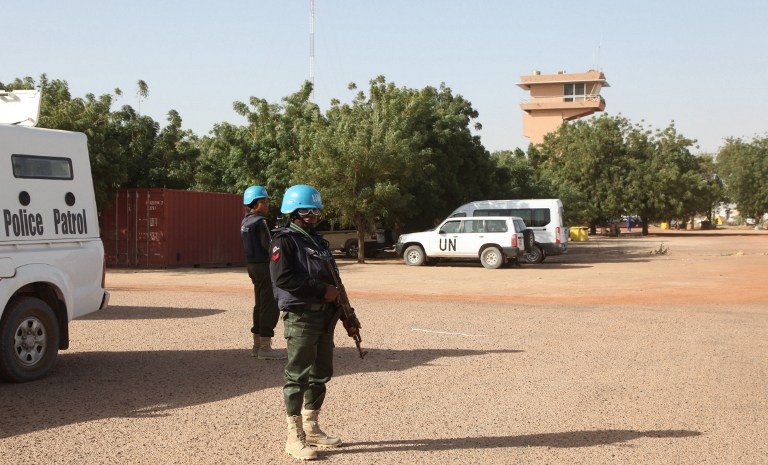 PEACEKEEPERS IN MALI. UN peacekeepers stand guard near the airport on February 4, 2016 in Timbuktu, central Mali. File photo by Sébastien Rieussec/AFP   