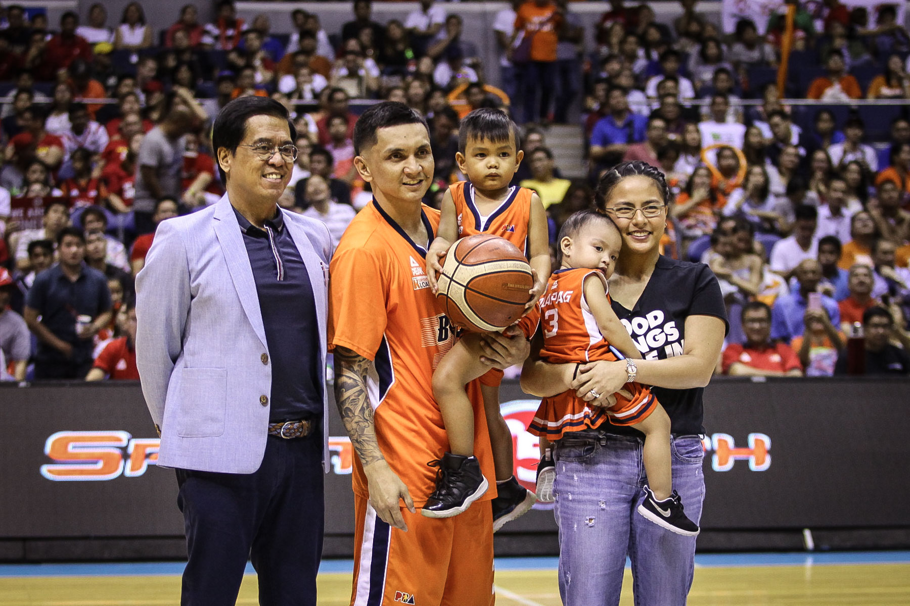 SHATTERING RECORDS. Jimmy Alapag (with his family and Commissioner Narvasa) is recognized after breaking the PBA's all-time 3-point record in Game 2 of the finals. File photo by Josh Albelda/Rappler  