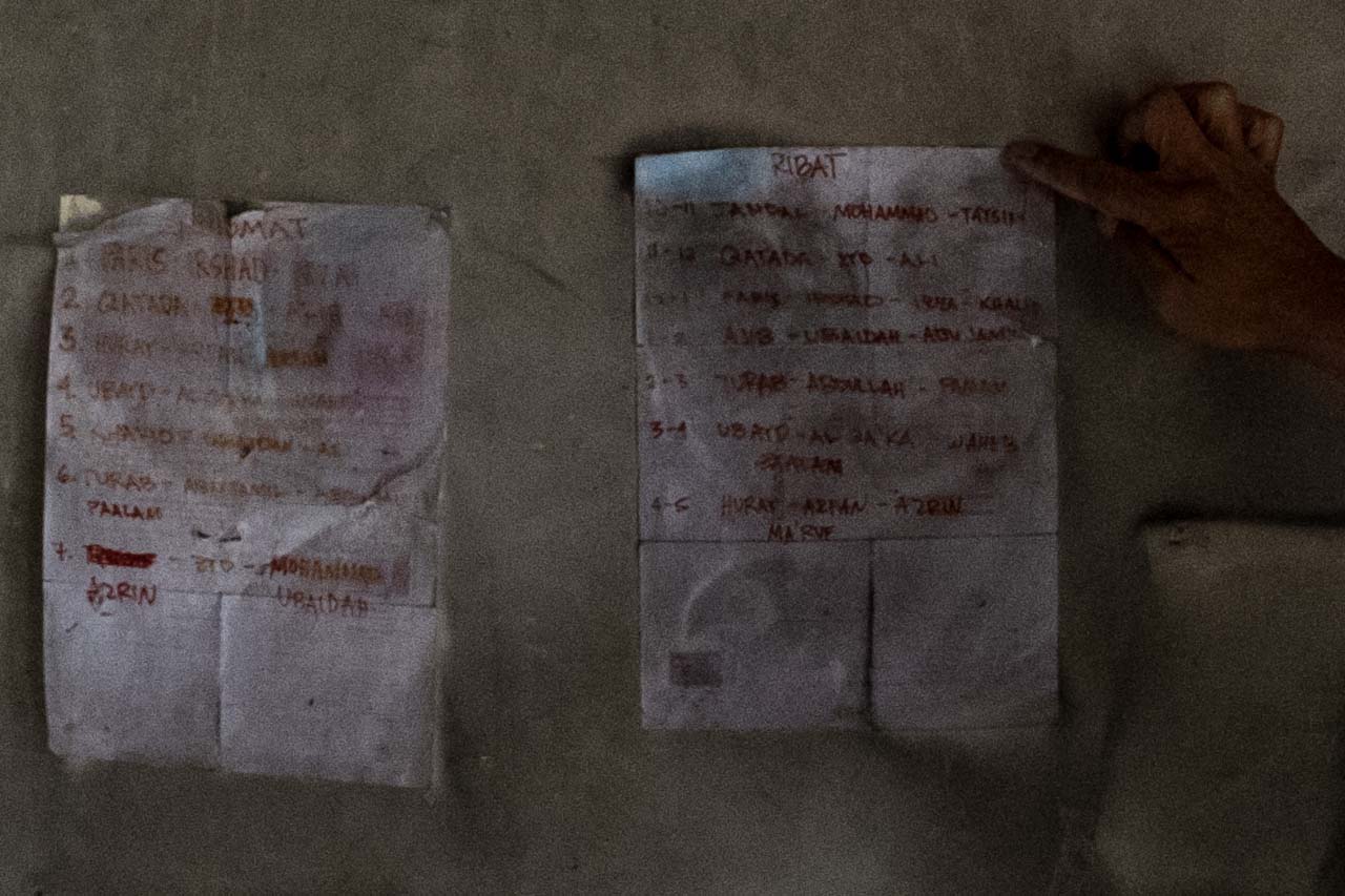 LISTED. Pieces of paper posted on the wall on the second floor of the rented apartment of Isnilon Hapilon. Bobby Lagsa/Rappler  