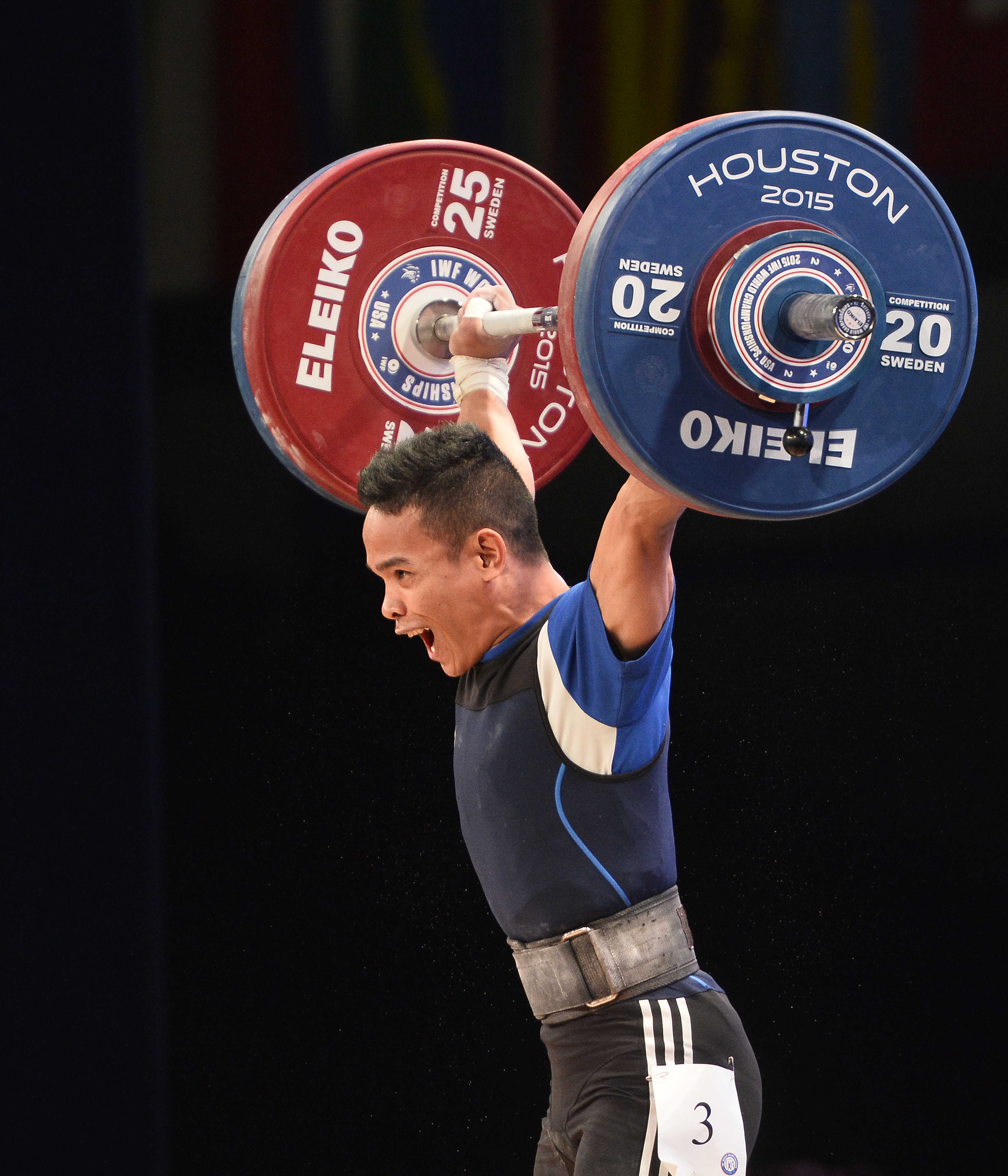 BRONZE MEDALIST. Nestor Colonia completes this lift in the men's 56kg weight class at the 2015 Weightlifting World Championships, where he won a bronze medal. EPA/LARRY W. SMITH  