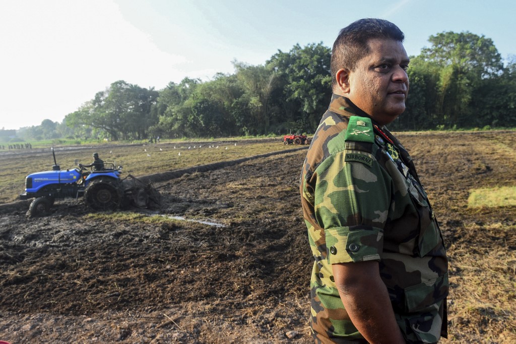 BANNED. Sri Lanka's Army chief Shavendra Silva (R) oversees a military operation to revive abandoned rice paddies, as part of a nationwide effort to improve agricultural productivity, near Colombo on January 14, 2020. Photo by Ishara S. Kodikara/AFP 