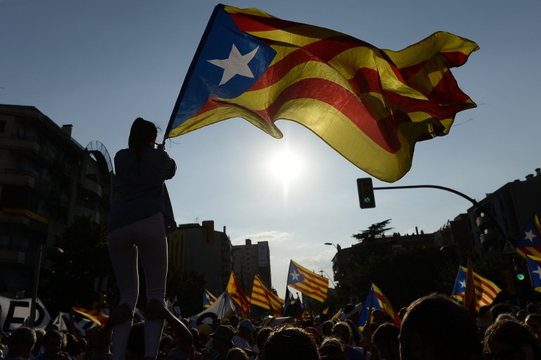 CATALAN VOTE. This file photo taken on September 11, 2016 shows people waving 'Estaladas' (pro-independence Catalan flags) during a pro-independence demonstration in Barcelona during the National Day of Catalonia 'Diada'. File photo by Josep Lago/AFP   