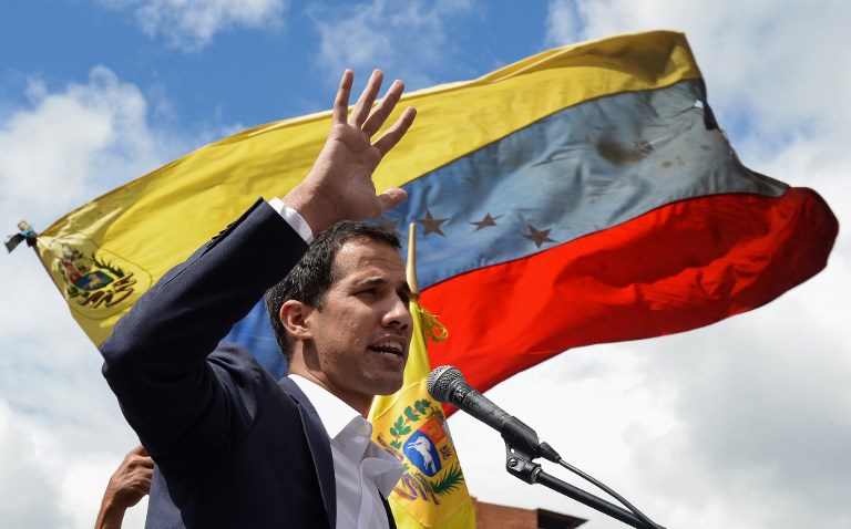 OPPOSITION LEAD. Venezuela's National Assembly head Juan Guaido speaks to the crowd during a mass opposition rally against leader Nicolas Maduro in which he declared himself the country's "acting president". File photo by Federico PARRA / AFP 