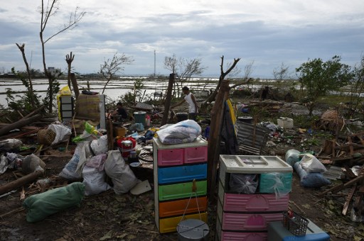 MAN VS NATURE. A man surveys the remains of his house after it was destroyed by super typhoon Haima in Cabagan town, Isabela province, north of Manila on October 20, 2016. Photo credits: Ted Aljibe/AFP 